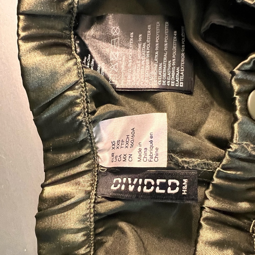 Jogger pants olive green; material satin. H&M